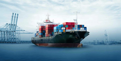 Large cargo container ship transporting shipping containers at a commercial seaport